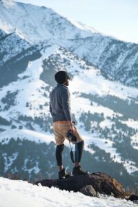 Adventurer explores snowy terrain in Ak-Talaa District, showcasing the beauty of Kyrgyzstan's winter landscape.